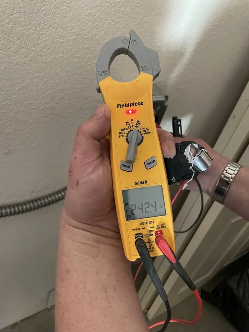 Voltage testing with clamp meter during Circuit Breaker Repair in Woodlawn